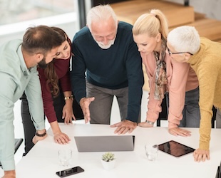 people meeting around a laptop